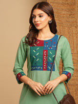 A-line kurta in cotton blend fabric with hand embroidery and applique detailing.