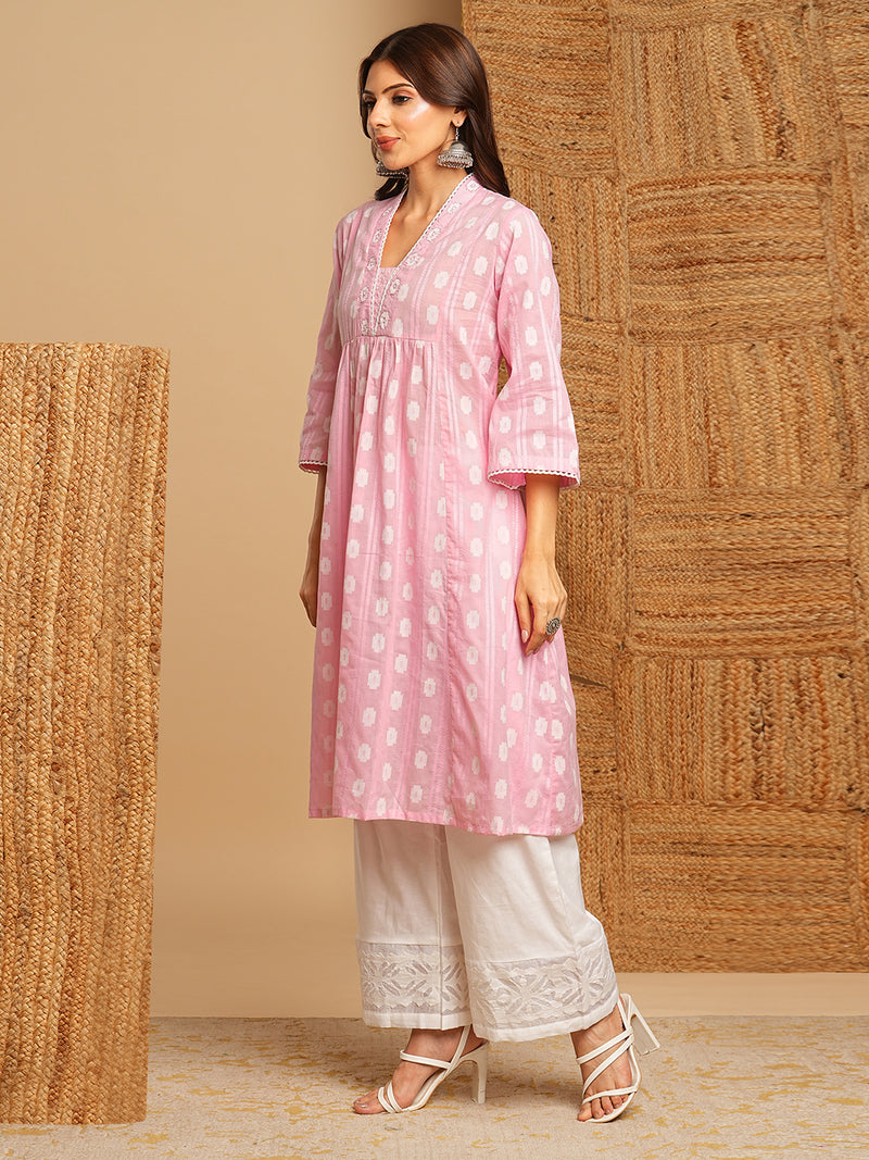 Flared kurta in woven cotton fabric with with gathering and hand embroidery.