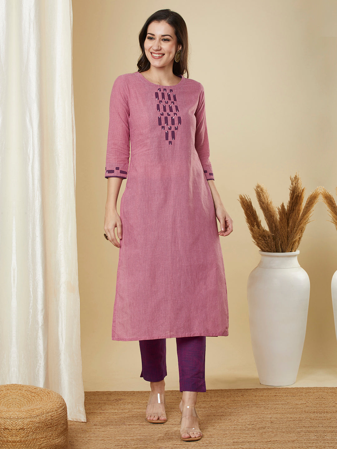 Straight cut kurta in  woven cotton fabric with hand applique and embroidery