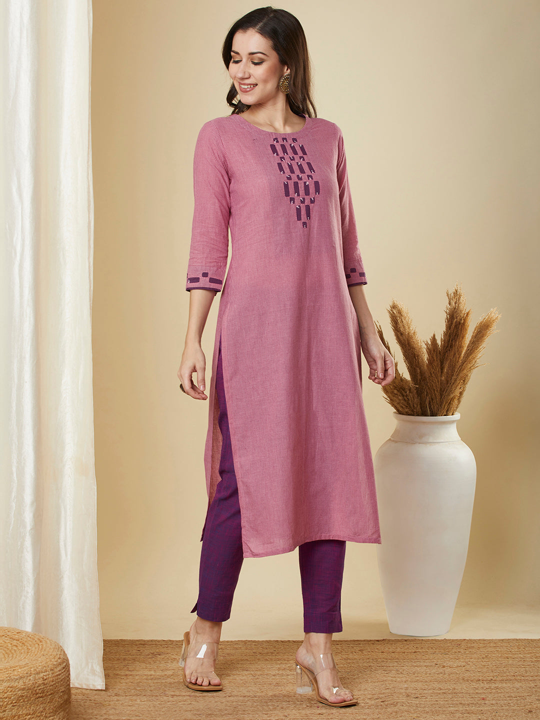 Straight cut kurta in  woven cotton fabric with hand applique and embroidery