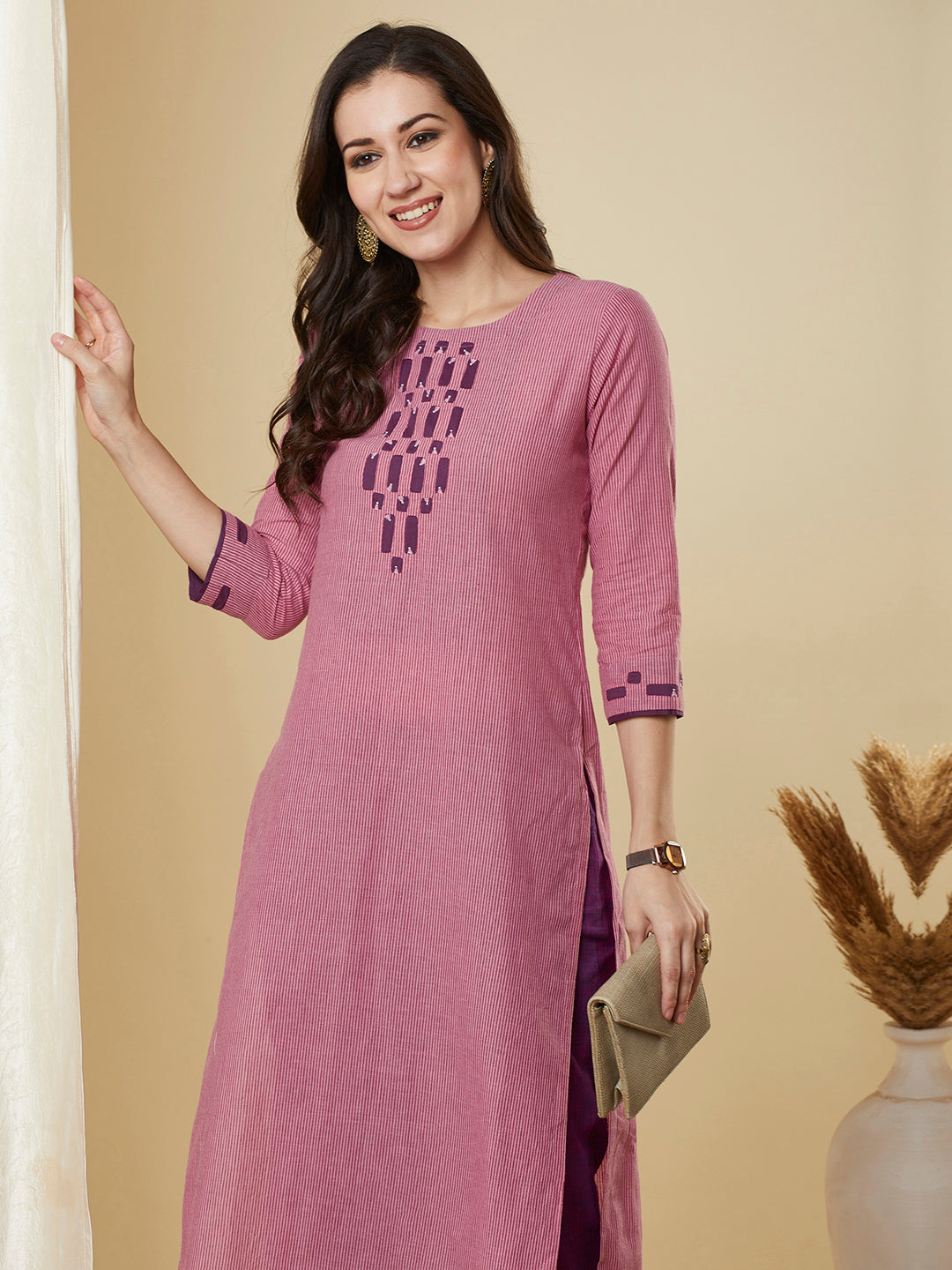 Straight cut kurta in  woven cotton fabric with hand applique and embroidery
