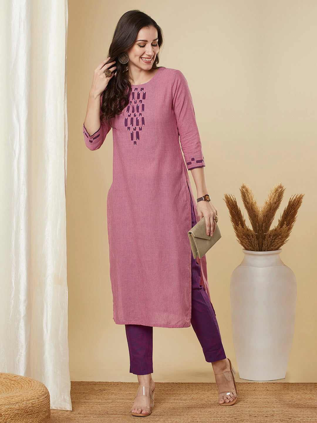 Straight cut kurta in  woven cotton fabric with hand applique and embroidery