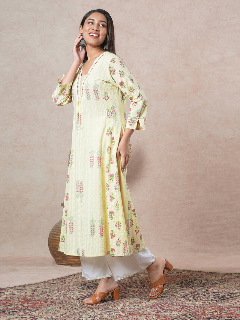 A-line cotton kurta  with embroidered neckline and blend of two different prints.