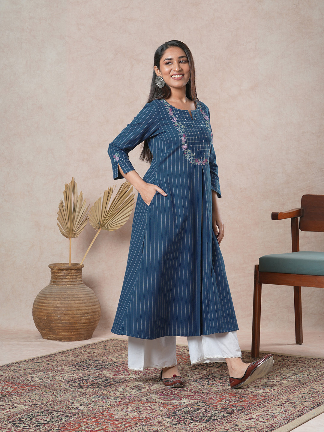 Embroidered A-line kurta with intricate beadwork and side pocket
