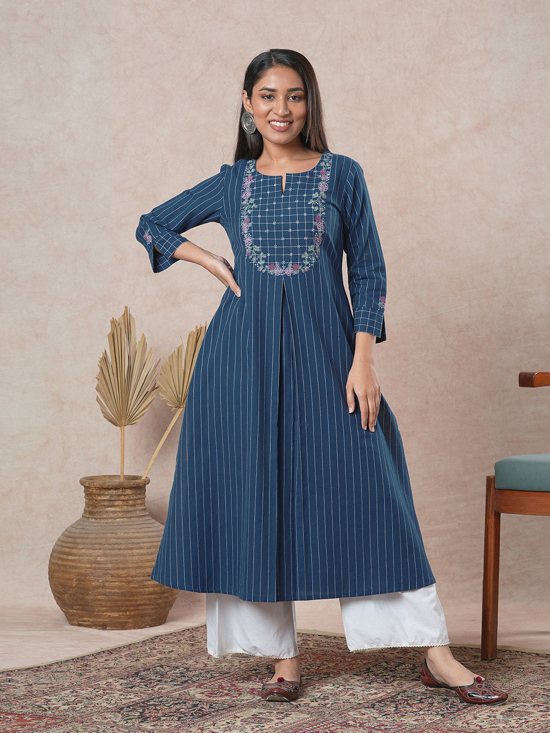 Embroidered A-line kurta with intricate beadwork and side pocket