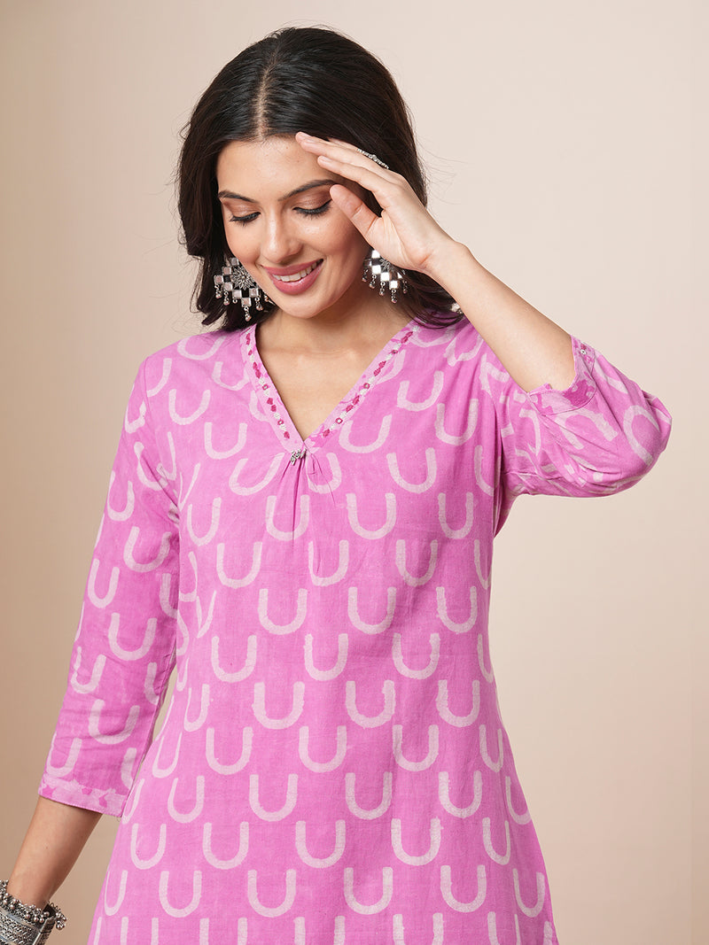 Dhabu print a line kurta with intricate hand embroidery.