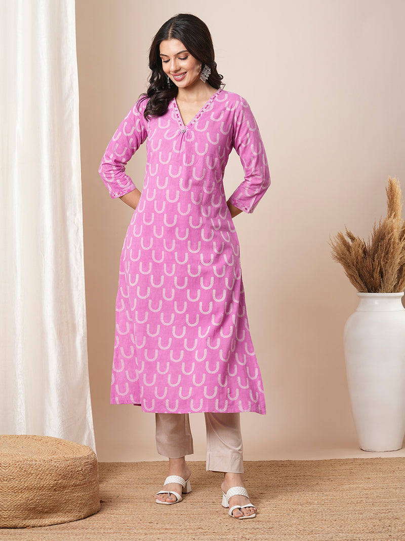 Dhabu print a line kurta with intricate hand embroidery.