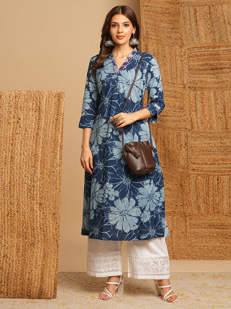 A-line kurta in dhabu print with hand embroidery detailing.