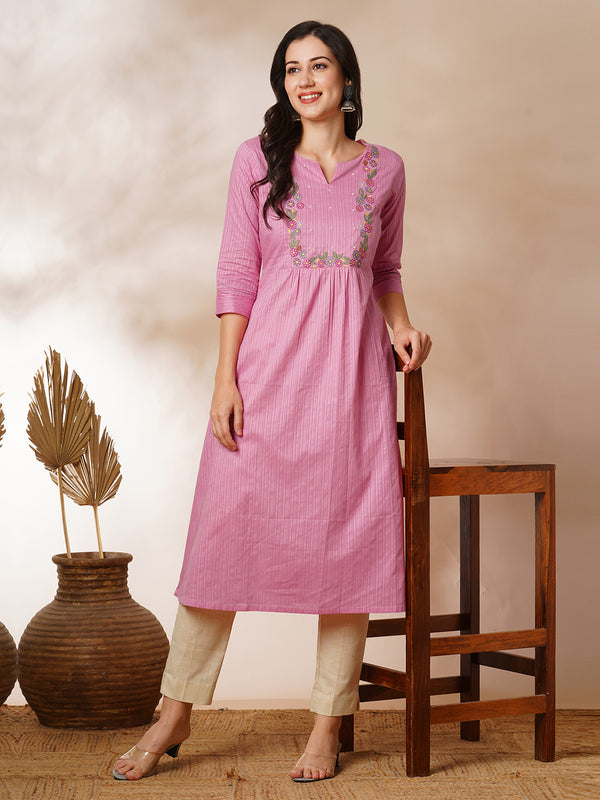 A-line kurta with beautifully embroidered yoke with beadwork detailing.