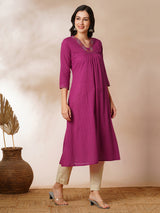 A-line woven cotton kurta with vibrant thread embroidery and gathering.