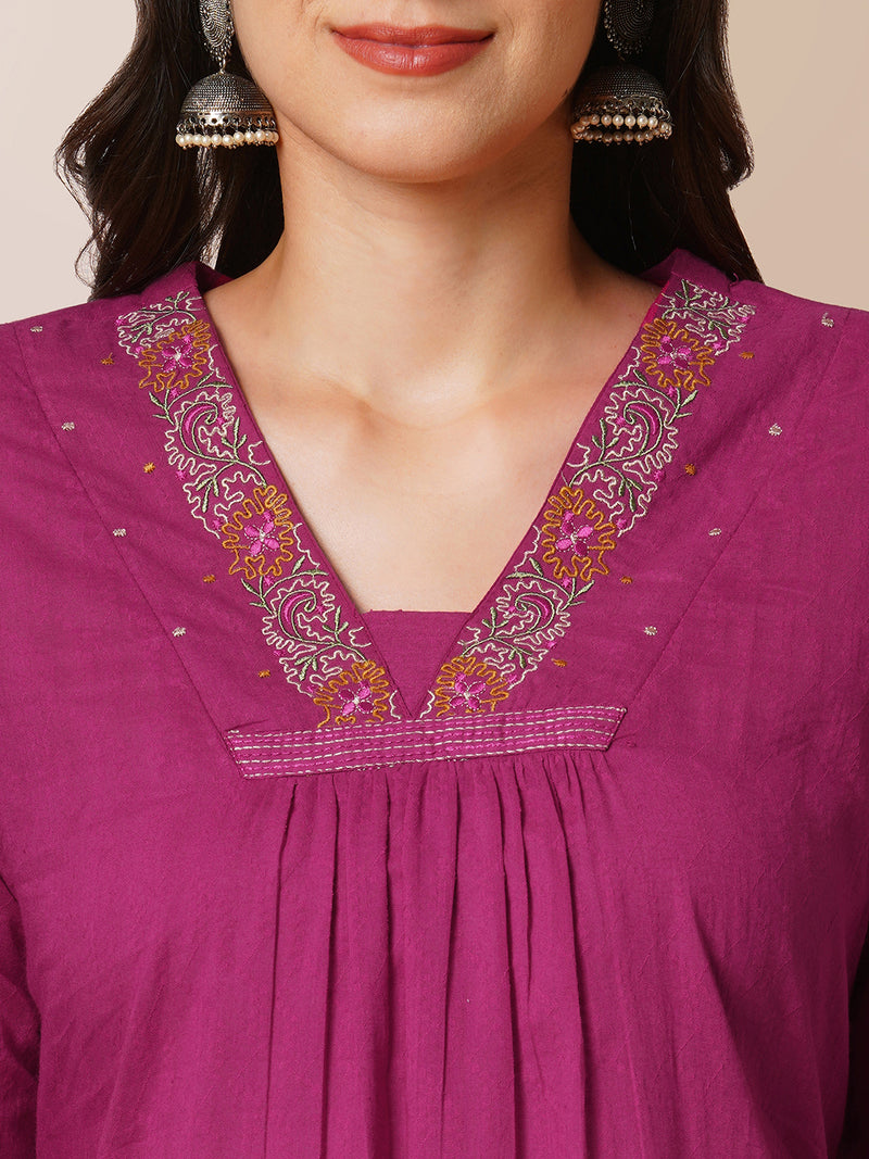 A-line woven cotton kurta with vibrant thread embroidery and gathering.