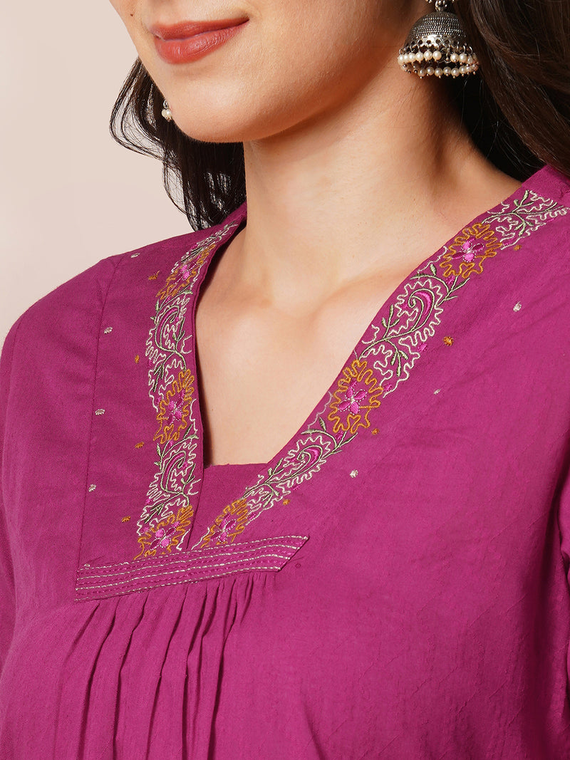 A-line woven cotton kurta with vibrant thread embroidery and gathering.