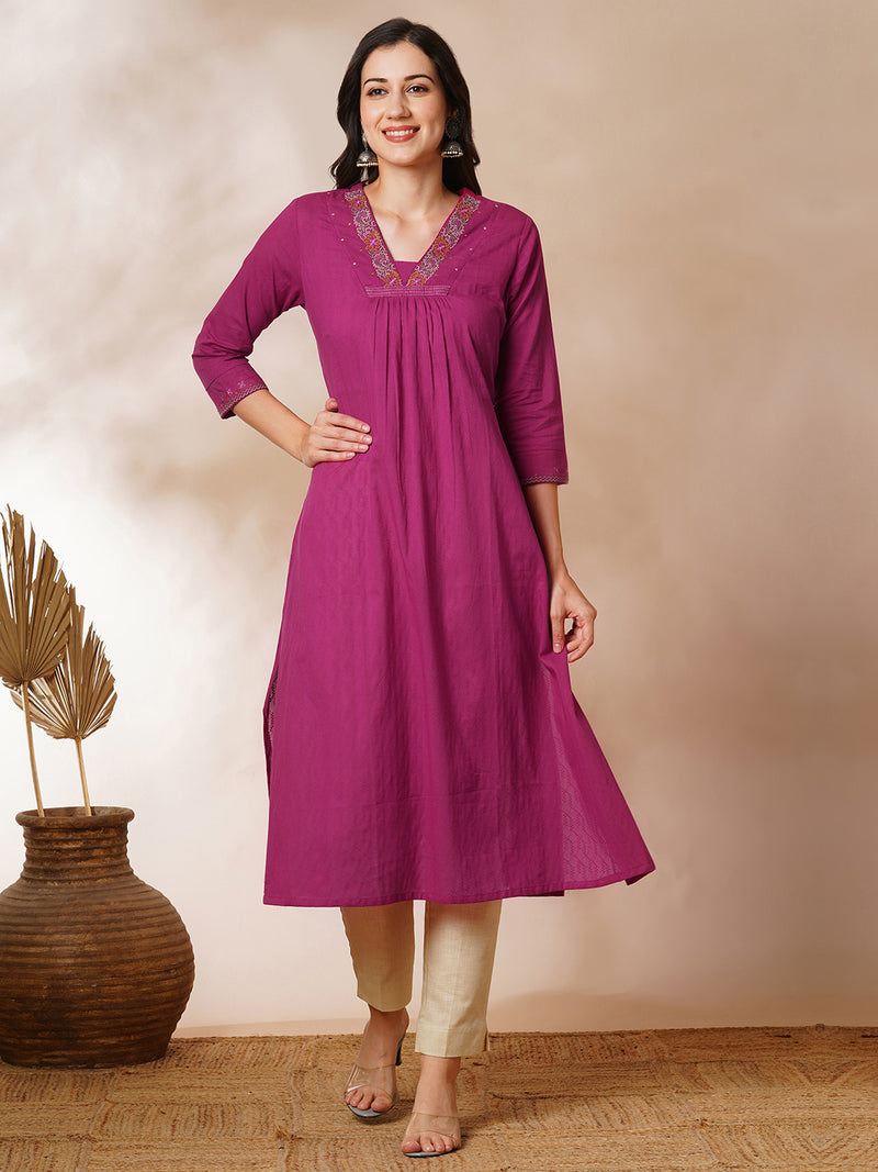 A-line woven cotton kurta with vibrant thread embroidery and gathering.