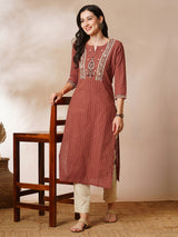 Straight kurta in striped cotton fabric with block printed yoke.