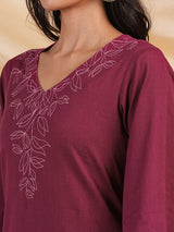 Straight kurta with minimal computer embroidery enhanced with mirror.