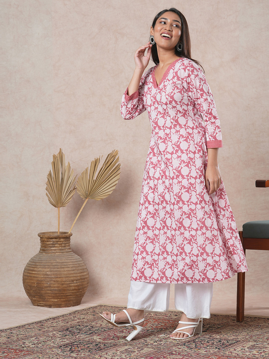 A-line cotton printed kurta with bead detailing around pleated V-neck and sleeve