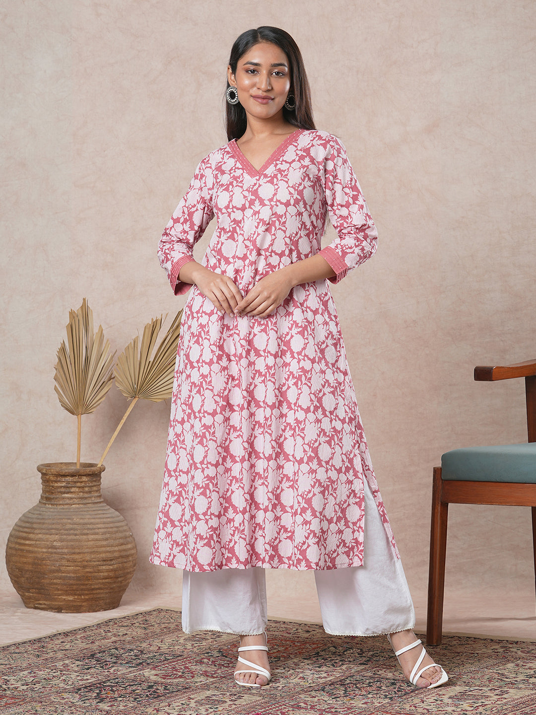 A-line cotton printed kurta with bead detailing around pleated V-neck and sleeve