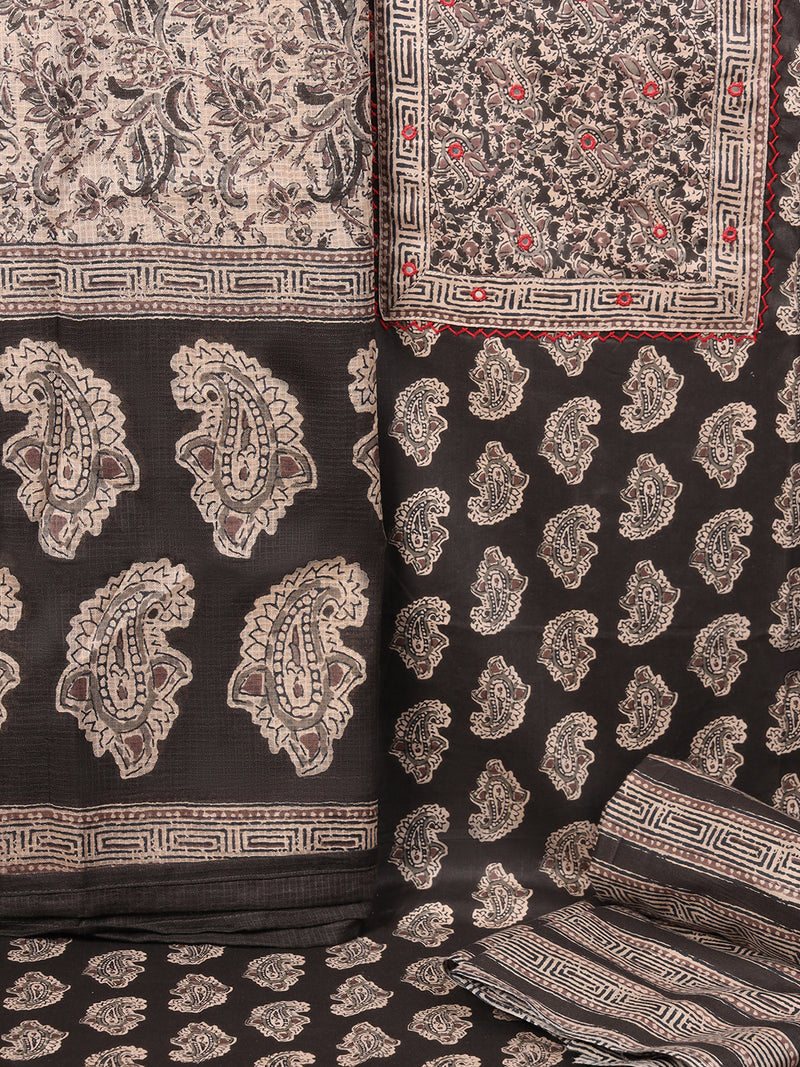 A black classic paisley-printed unstitched suit set with a mix-and-match yoke and contrasting-coloured handwork.