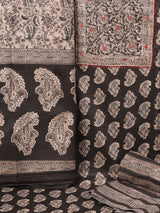 A black classic paisley-printed unstitched suit set with a mix-and-match yoke and contrasting-coloured handwork.