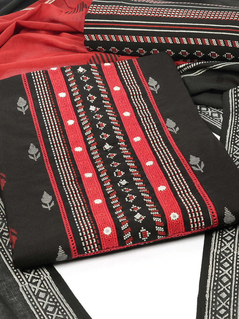 Black unstitched suit set with a block-printed dupatta and mix-match yoke.