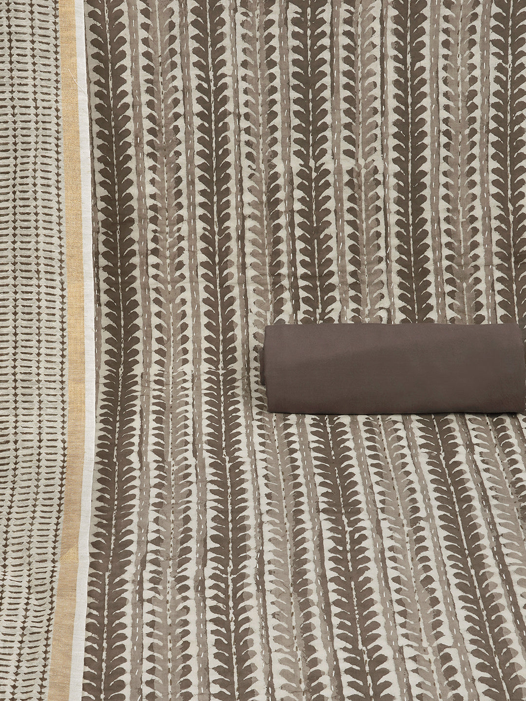 Brown unstitched suit set with traditional dabu print along with printed dupatta and solid bottom