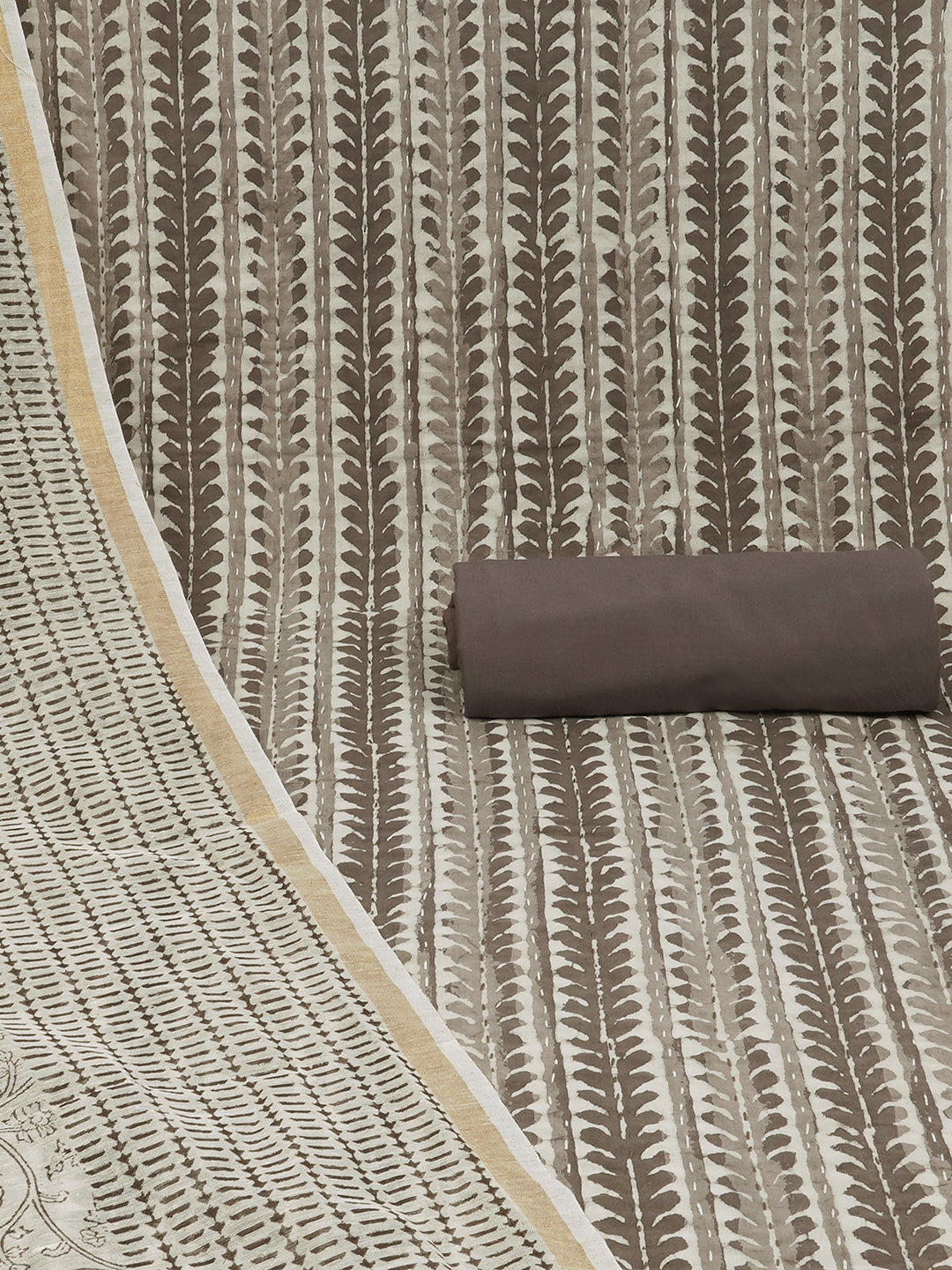 Brown unstitched suit set with traditional dabu print along with printed dupatta and solid bottom