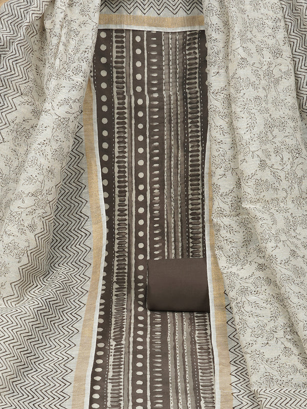 Brown unstitched suit set with traditional geomatric dabu print along with printed dupatta and solid bottom.