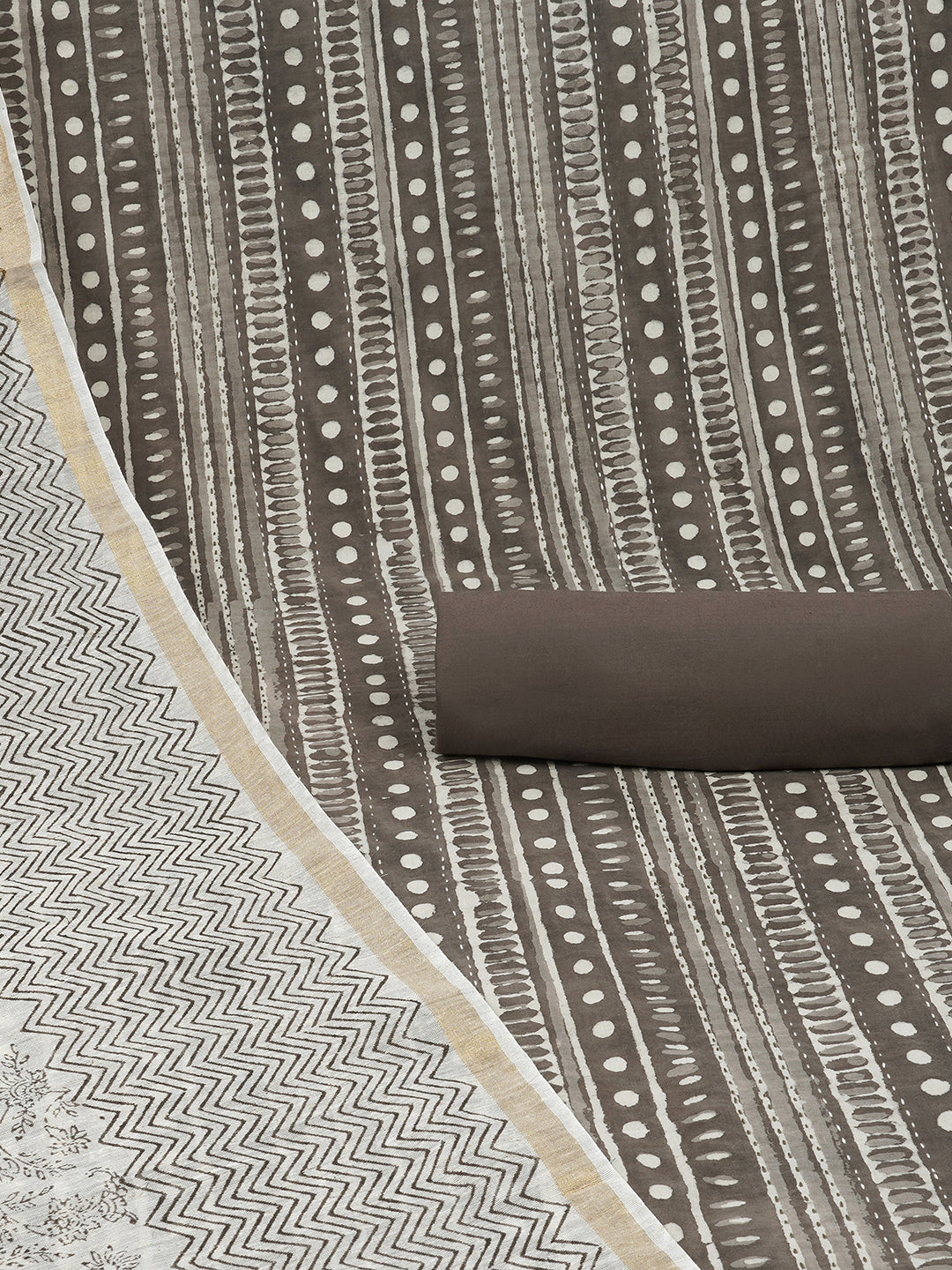 Brown unstitched suit set with traditional geometric dabu print along with printed dupatta and solid bottom