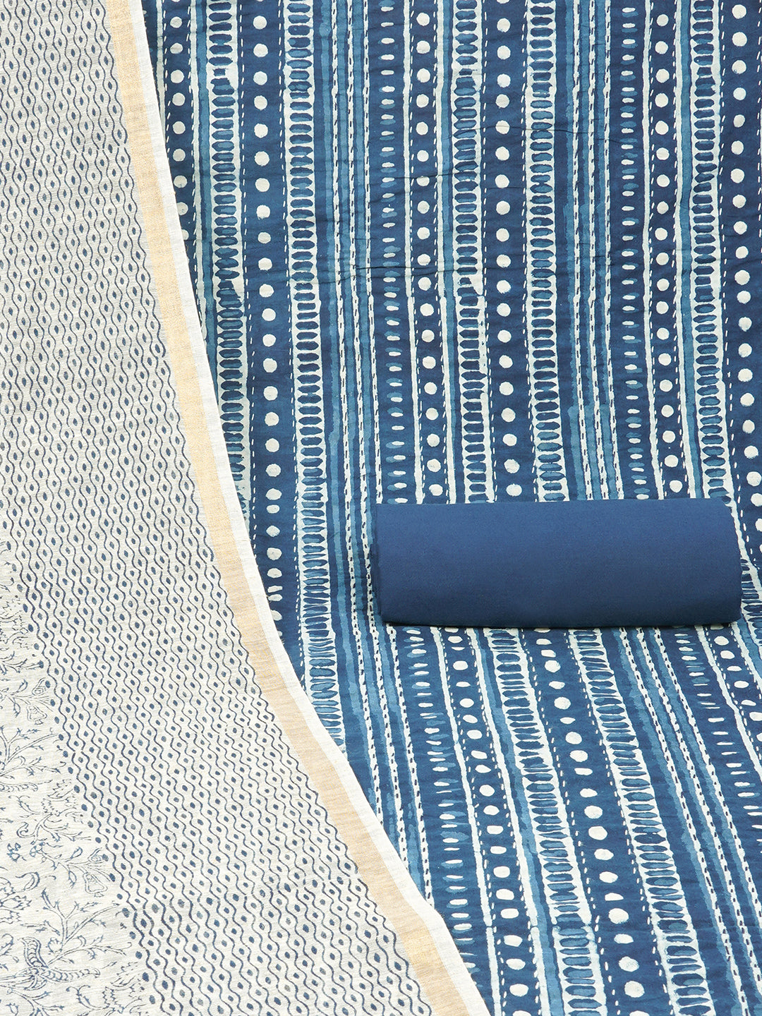 Blue unstitched suit set with traditional geometric dabu print along with printed dupatta and solid bottom