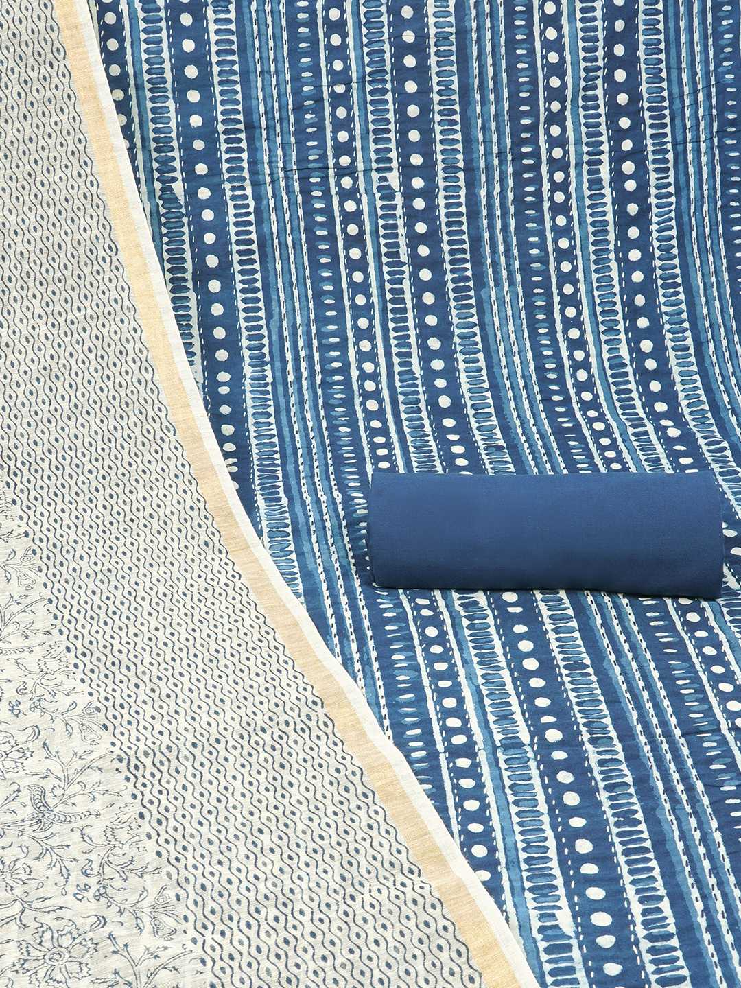 Blue unstitched suit set with traditional geometric dabu print along with printed dupatta and solid bottom