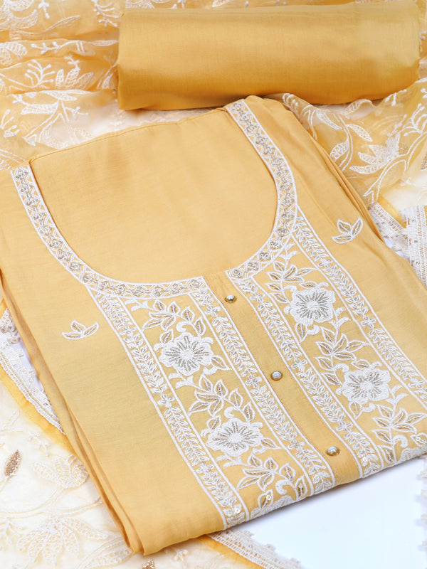 TASYA - Unstitched suits set is elevated with delicate white thread embroidery and organza dupatta.