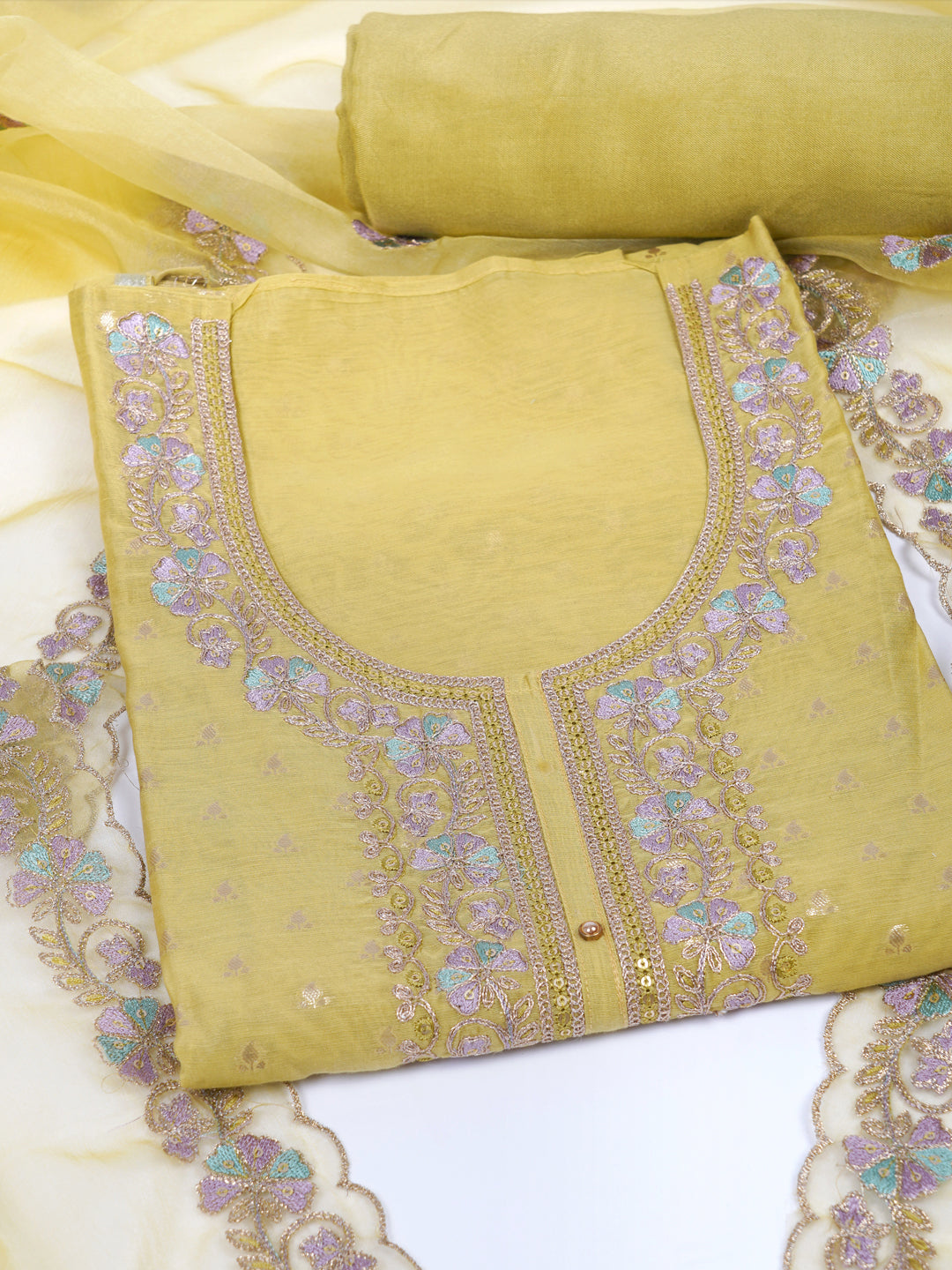 Party Edit- The unstitched dobby chanderi suit set features colourful resham and golden dori embroidery