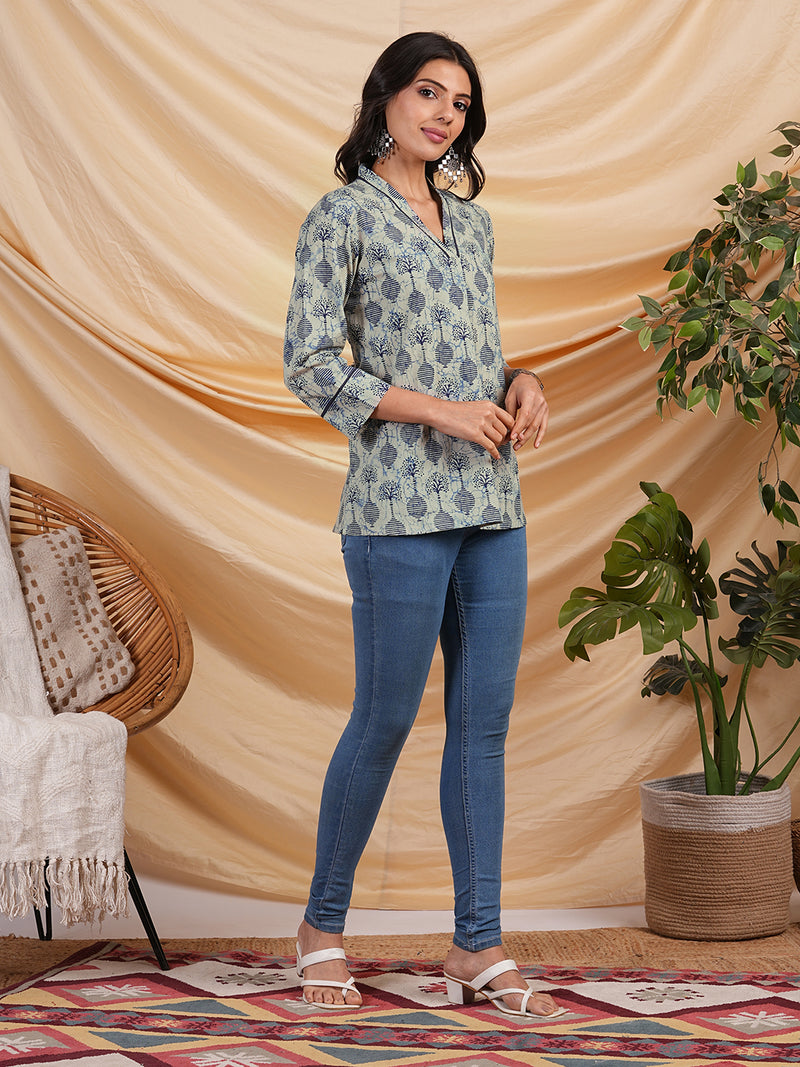 Flared printed cotton V neck top with lace detailing.