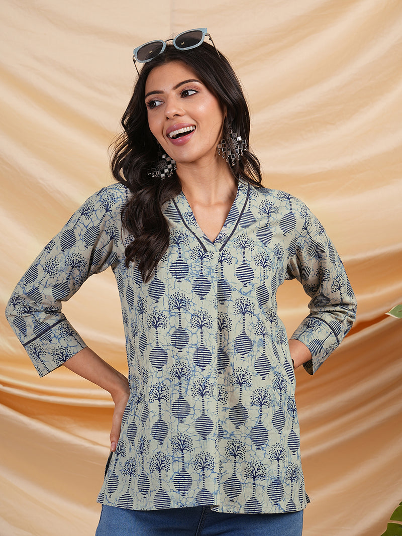 Flared printed cotton V neck top with lace detailing.