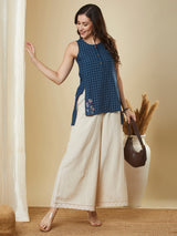 Sleeveless up and down top in woven cotton with embroidery detailing.