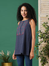 A-line south cotton tunic with checkered yoke and placket on front.