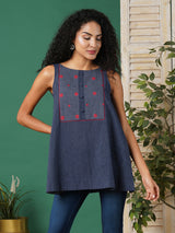 A-line south cotton tunic with checkered yoke and placket on front.