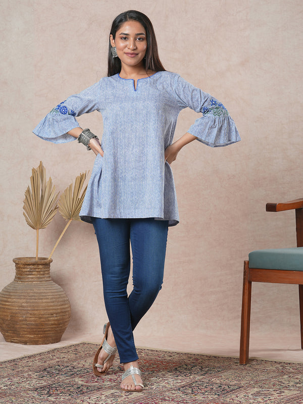 Flared printed cotton Tunic with machine embroidery on bell sleeve.