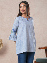 Flared printed cotton Tunic with machine embroidery on bell sleeve.