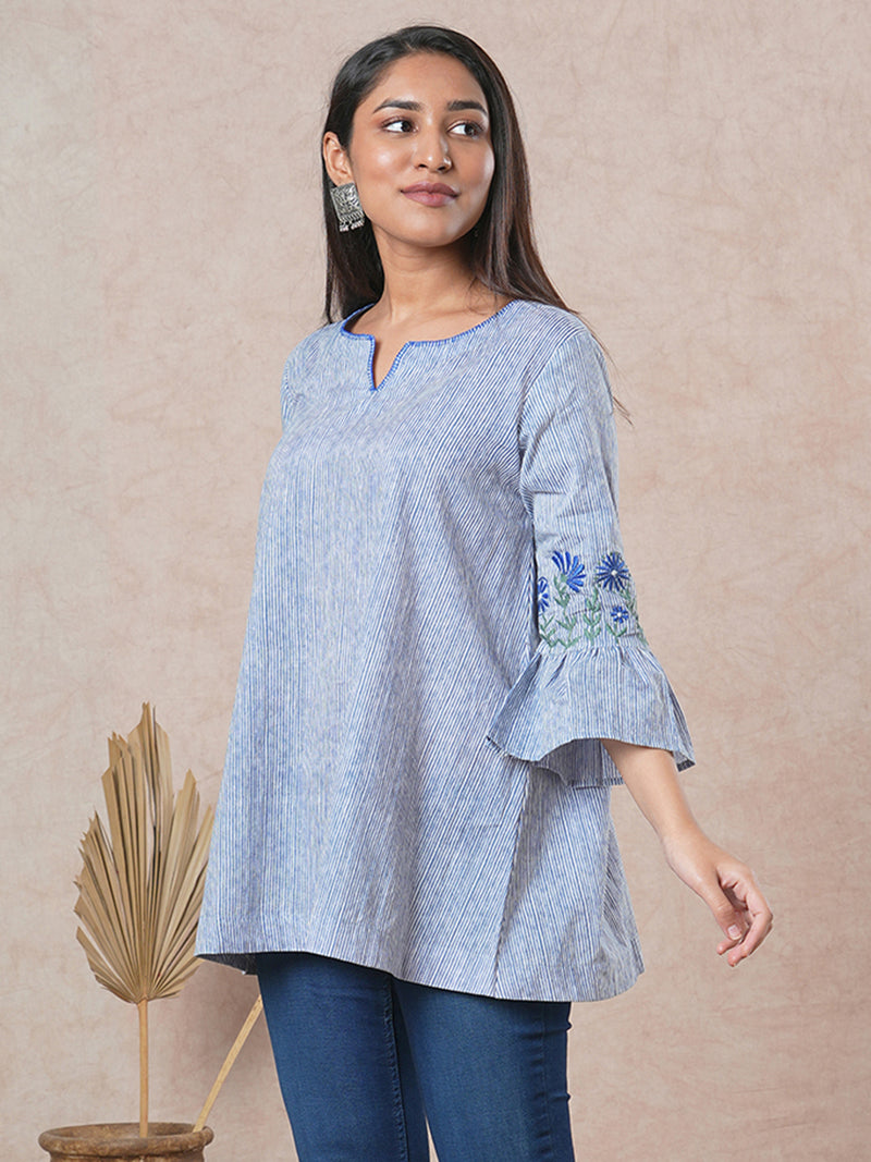 Flared printed cotton Tunic with machine embroidery on bell sleeve.