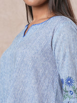 Flared printed cotton Tunic with machine embroidery on bell sleeve.