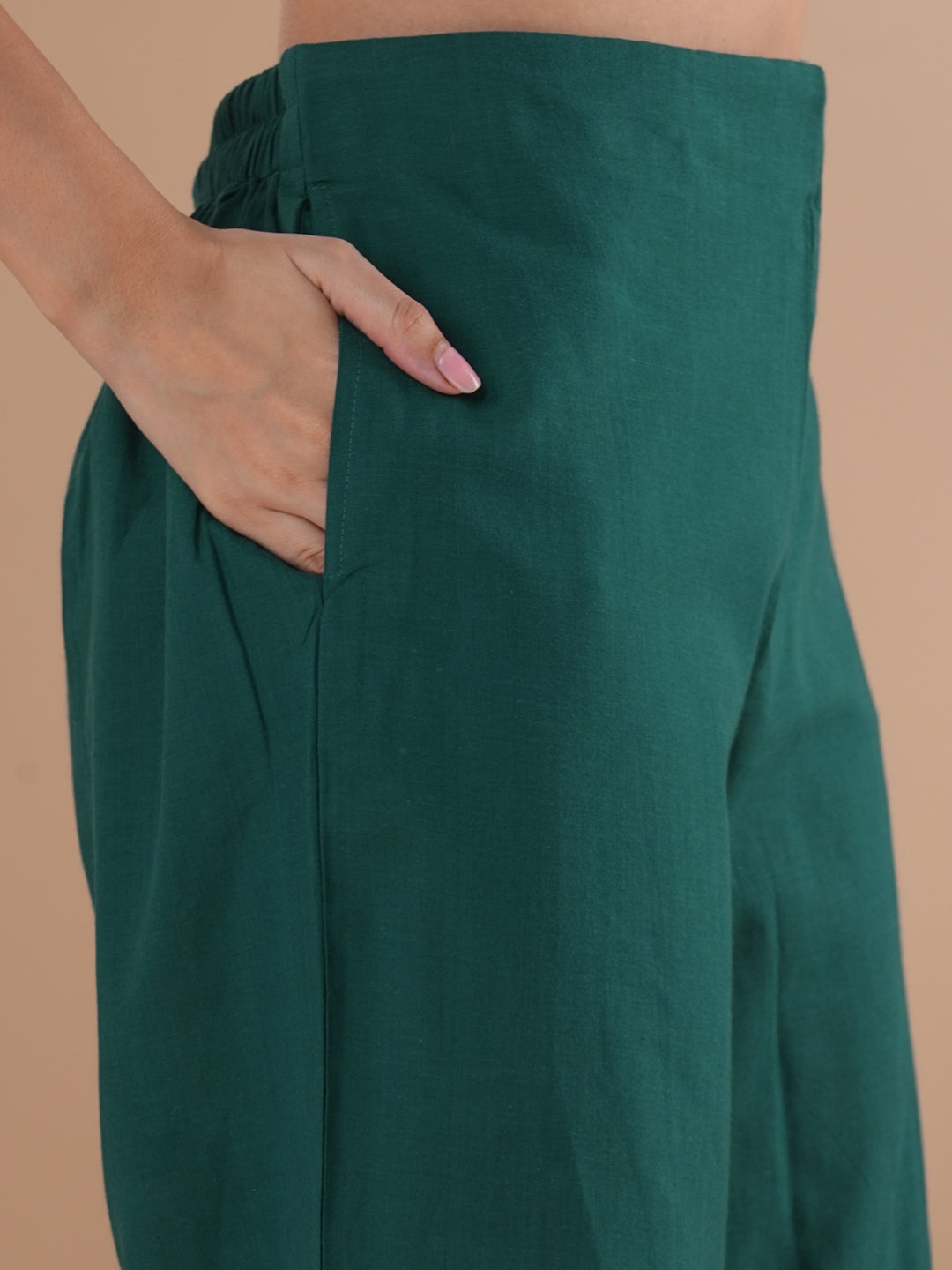 A co-Ord set with a lapel collar top with loop detailing on the sleeves paired with solid palazzos