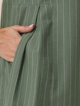 Striped sleeveless dress with notch collar and a side box pleat.