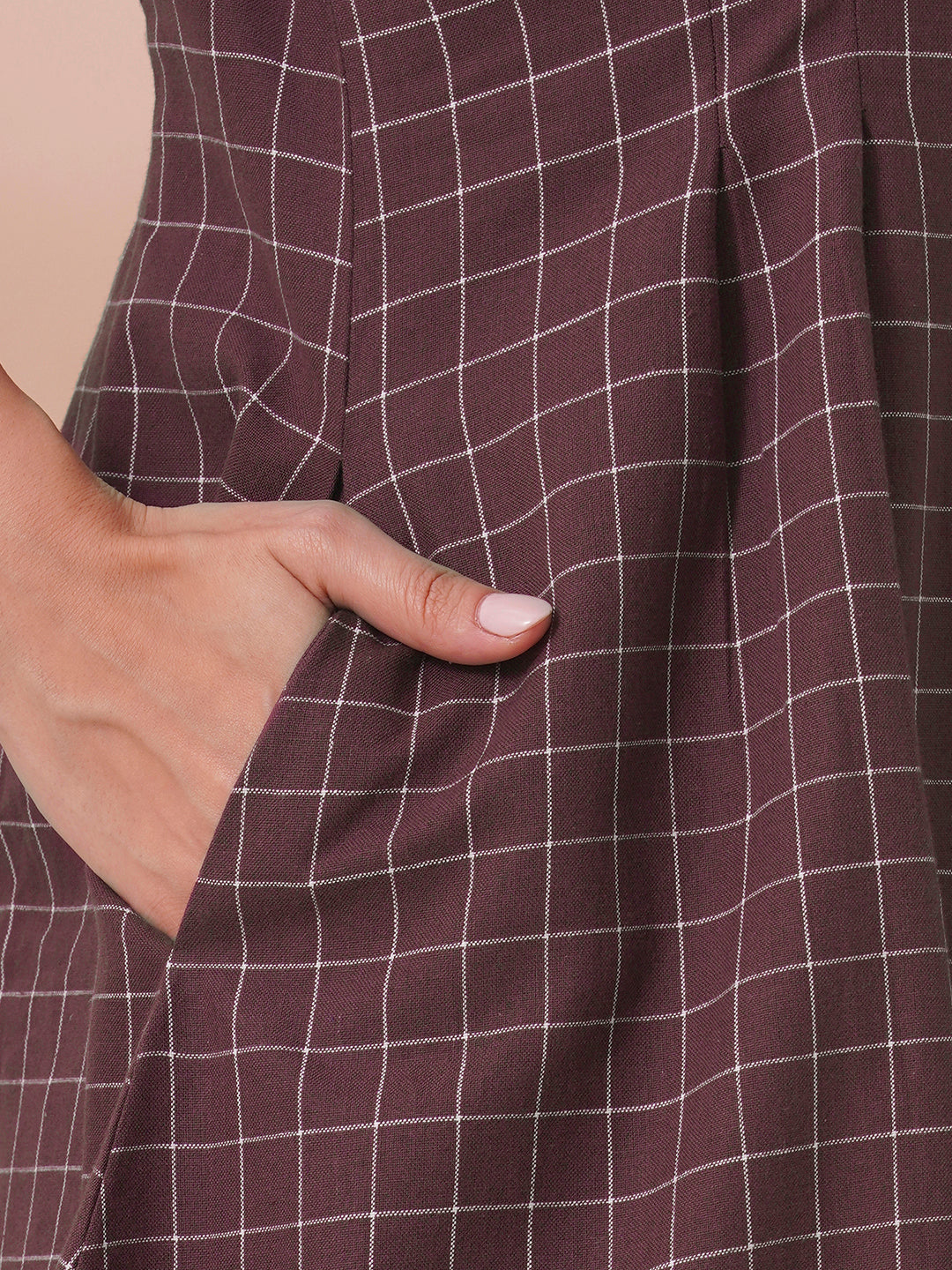 Checkered Fit and Flare dress with extended shoulder sleeve and pocket.