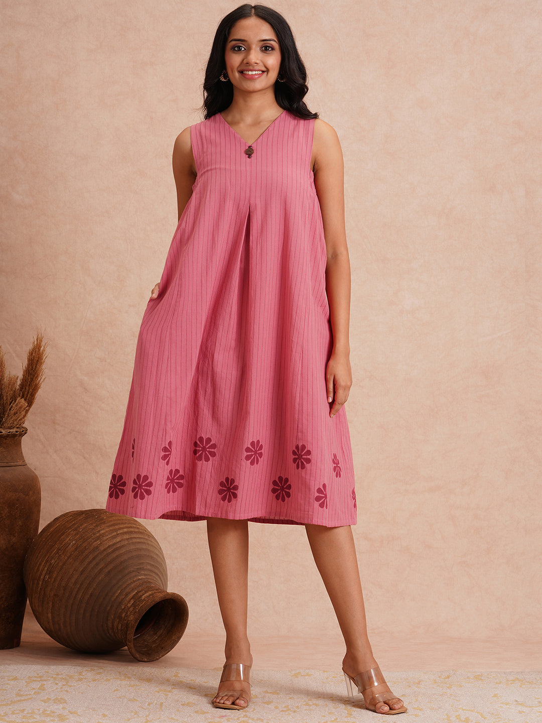 Pocketed dress in woven kantha fabric with elasticated side gathering and block print.