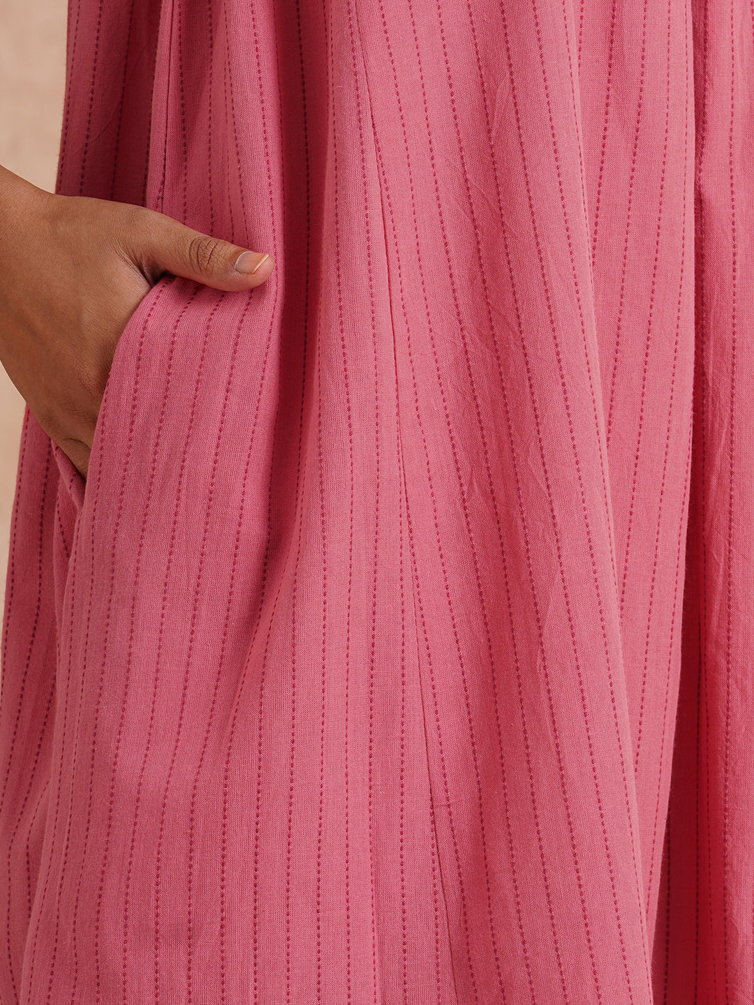 Pocketed dress in woven kantha fabric with elasticated side gathering and block print.