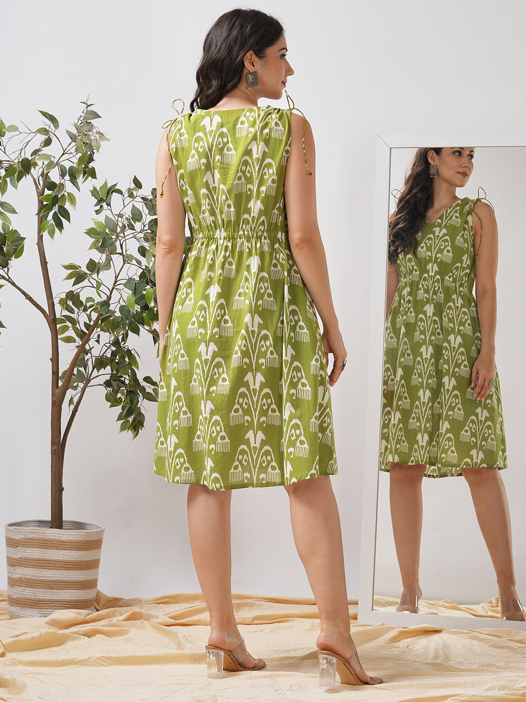 A-line dress with elasticated waist and gathered shoulders with dori and bead detail.