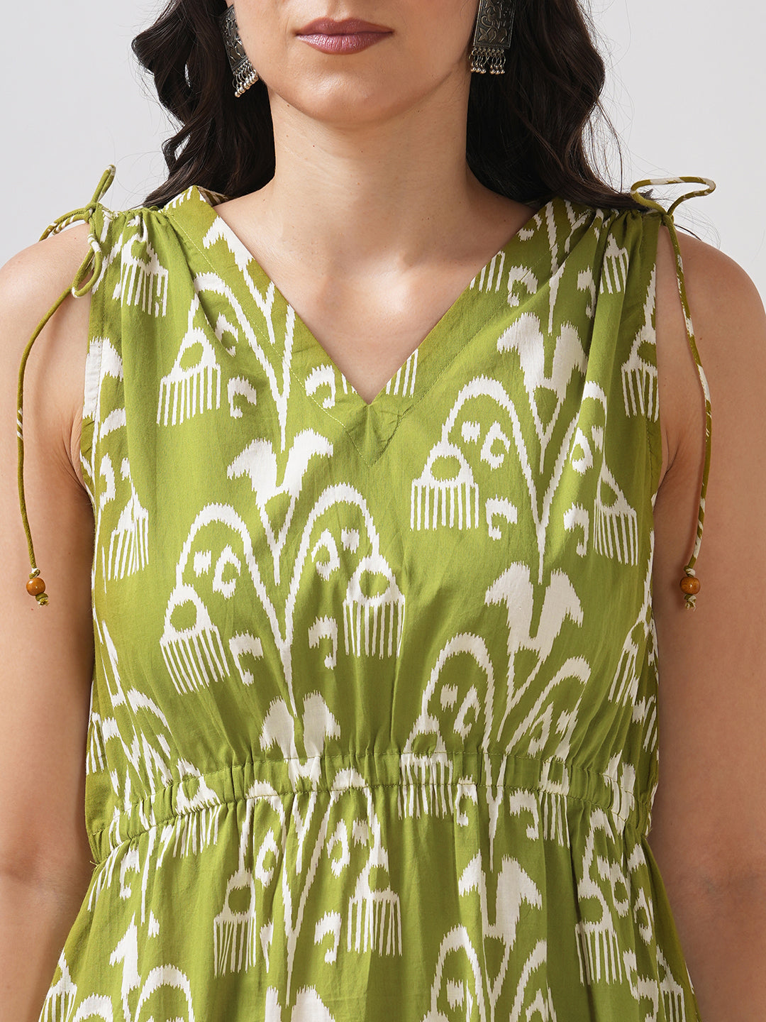 A-line dress with elasticated waist and gathered shoulders with dori and bead detail.