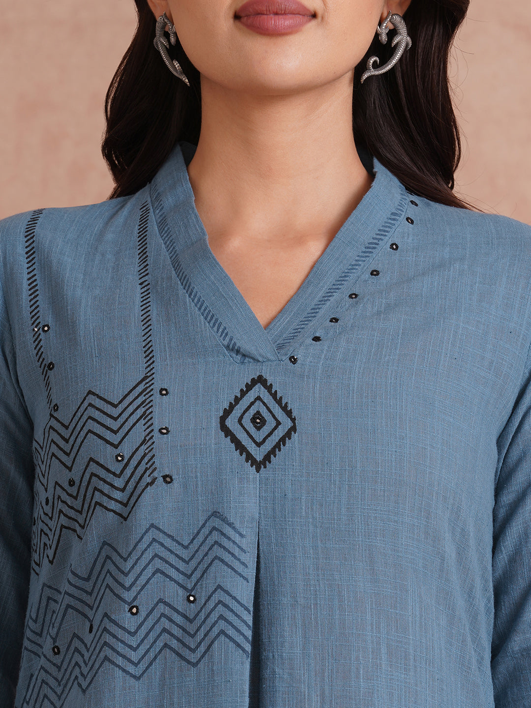 A-line placement block printed dress with centre box pleat in the front and sleeves.