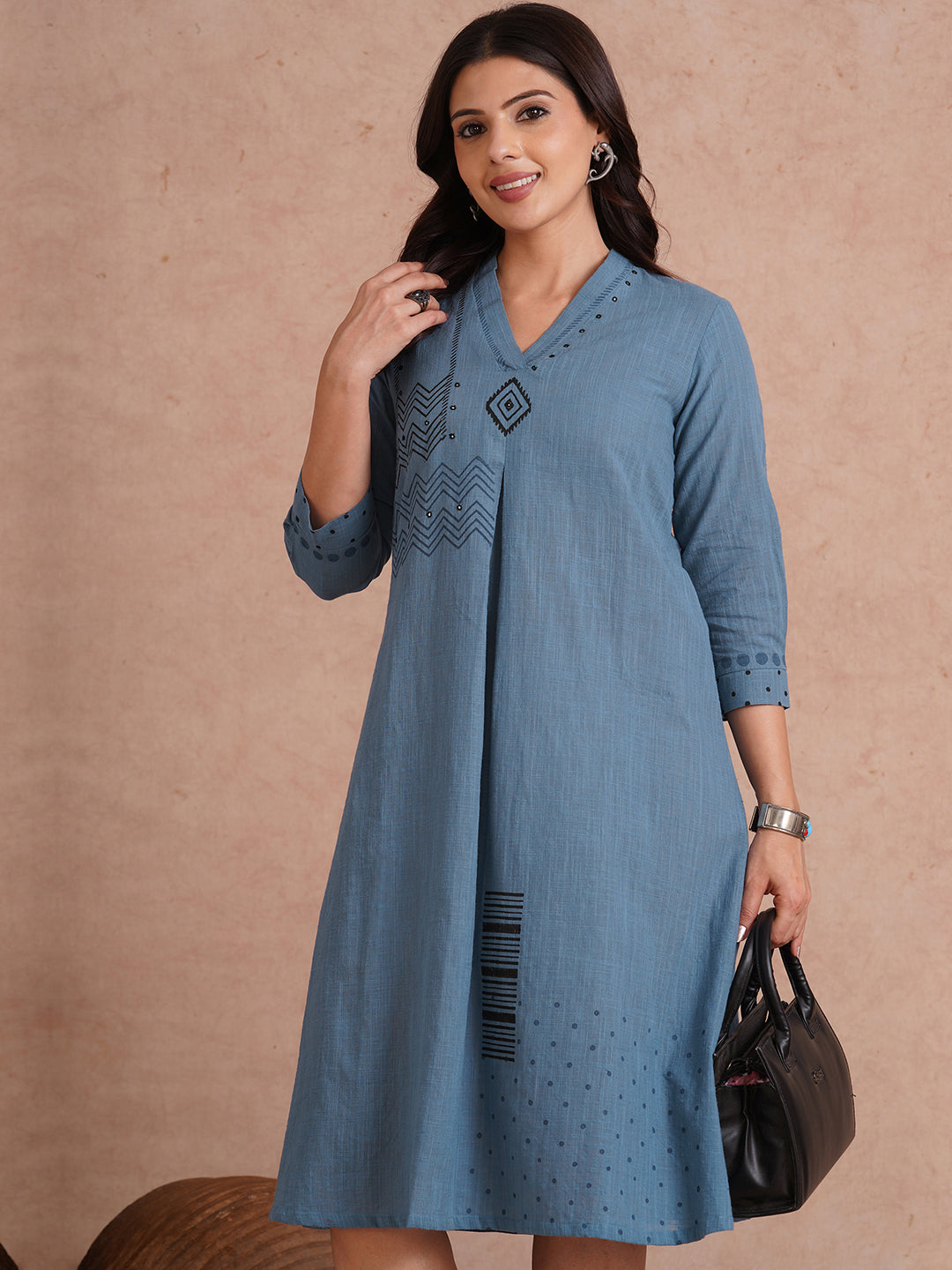 A-line placement block printed dress with centre box pleat in the front and sleeves.